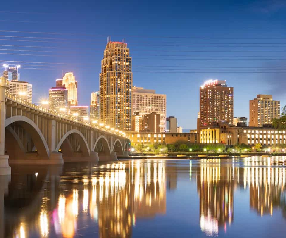 The Minneapolis skyline at night over the Mississippi River