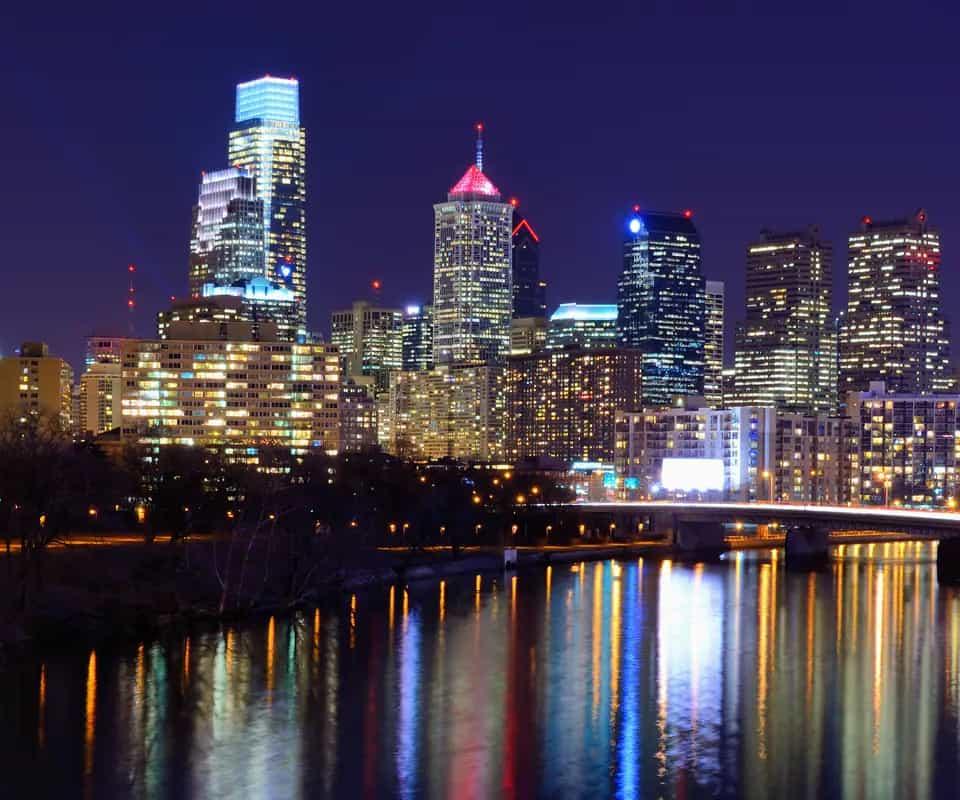 The Philadelphia skyline at night, reflected in the Schuylkill River